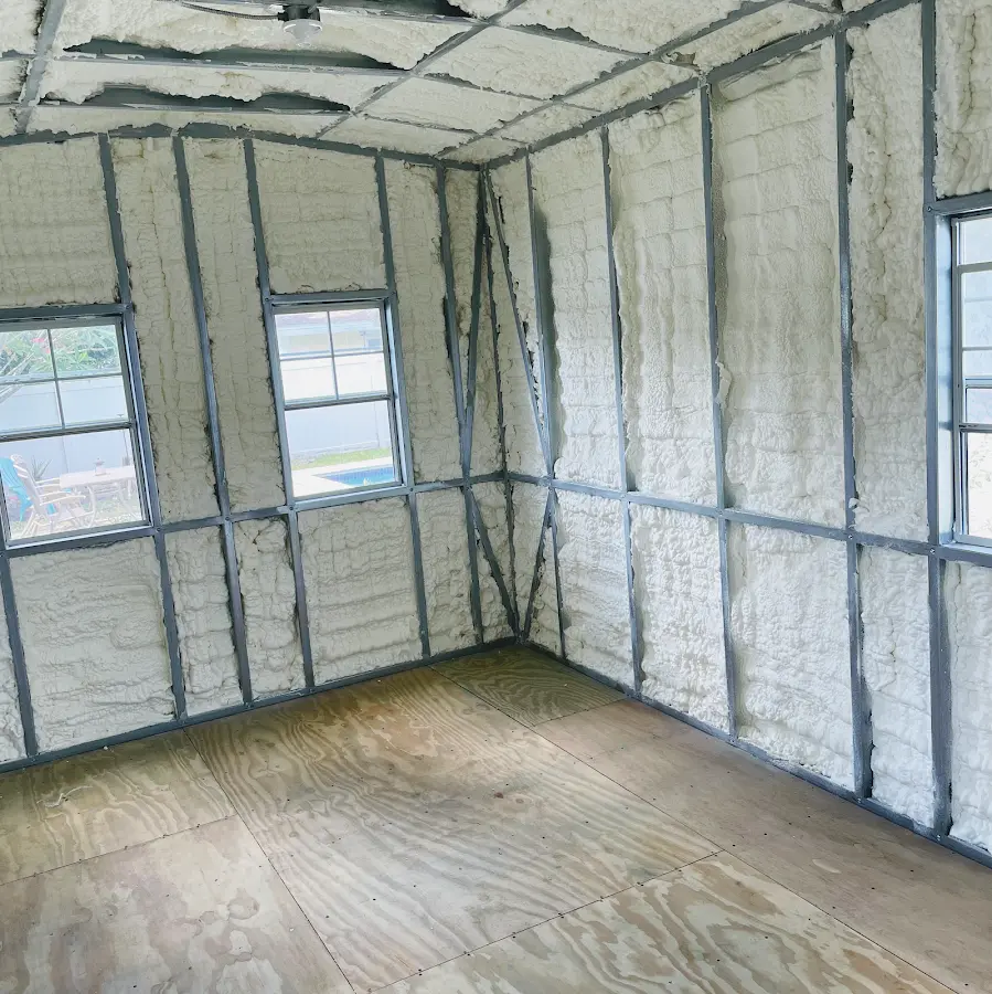 Closed-cell spray foam insulation applied to wall cavities in a residential project in Milton